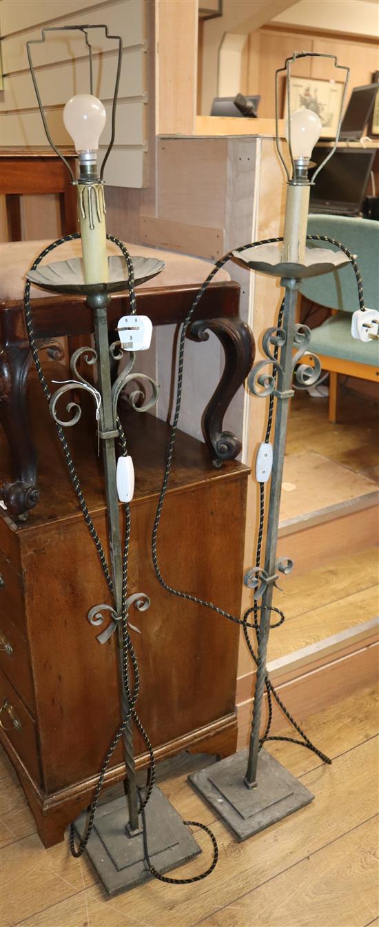 A pair of wrought iron standard lamps H.160cm